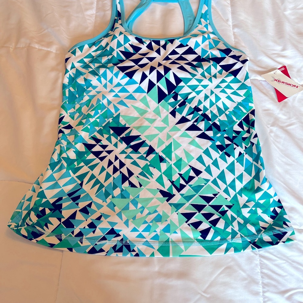 Ladies performance wear top with medium bra tank support.